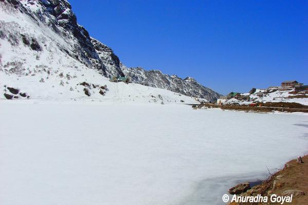 Frozen Tsomgo lake or Changu lake bed by the mountains