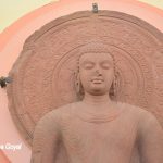 Buddha statue in Mathura School of Art style in Red Stone at Mathura Museum