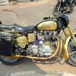 A Golden colored Motor Bike on the streets of Shah Ali Banda, Hyderabad