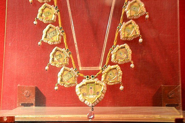 Jewelry with miniature paintings on display