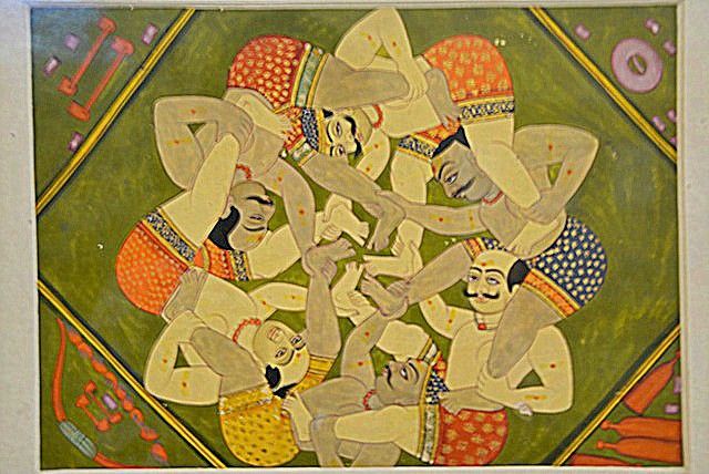 Miniature painting showcasing entangled wrestlers at the museum - Museums of India to visit