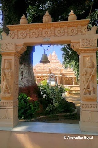 Landscape view of the Shwetambar Jain Temple through a Toran