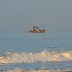 Fishermen sailing out to seas early morning at Utorda beach