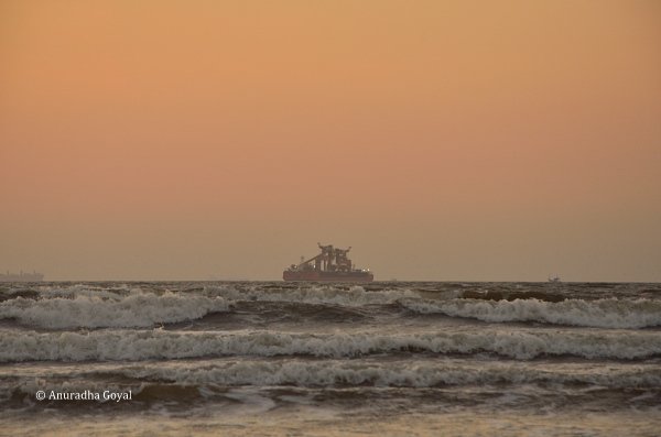 Lights are on at the ship as seen from Caranzalem Beach