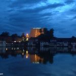 Landscape view of Padmanabhaswamy Temple and the tank at dusk
