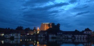 Landscape view of Padmanabhaswamy Temple and the tank at dusk