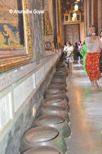 The row of bowls to put coins offered to Buddha