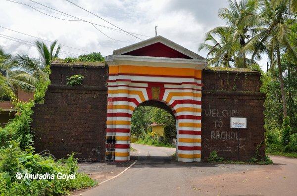 Colorful arch built of laterite stone wall en route Rachol