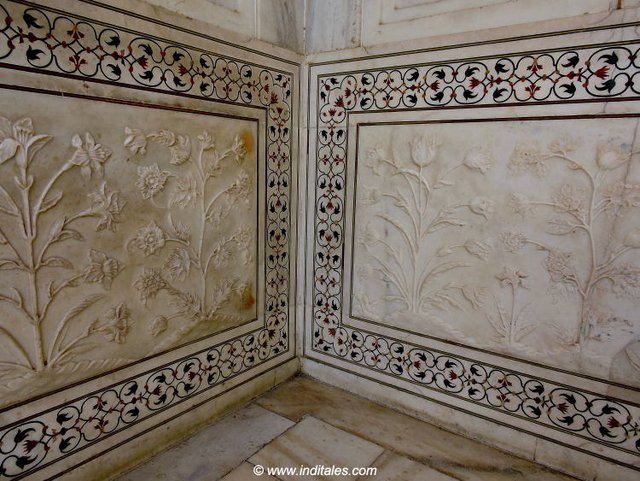 Play of marble carving and inlay on a border that goes around the base of Taj