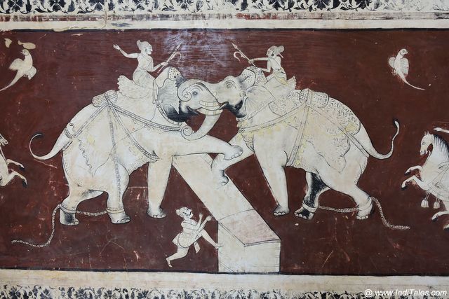 Bottom red and White panel of Elephant's participating in a war