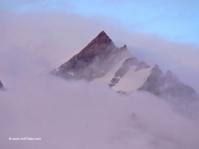 Sharp peaks emerging from the clouds