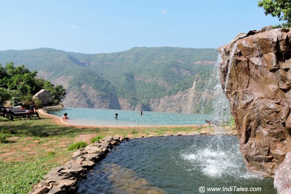 Swimming pool overlooking the waterfalls at Swapnagandha Resort, Chorla Ghat