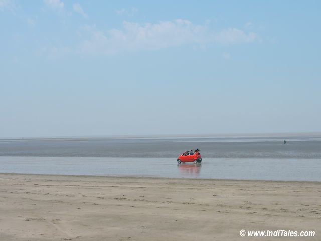 Red Car racing on Jampore beach, Daman