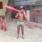 Wrestler exercising with jodi at Tulsi Akhada