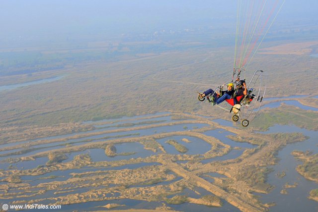 Powered Paraglider hovering over Krishna river