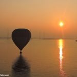 Sunrise scene with a Hot Air Balloon over Krishna river at Amaravati