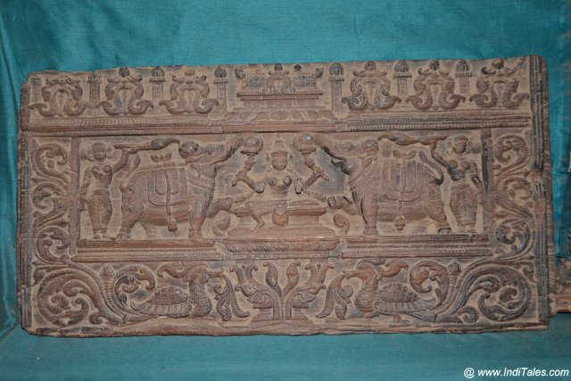 Intricately carved wooden panel at Koyikkal Palace