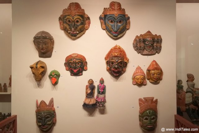 A display of carved painted wooden masks