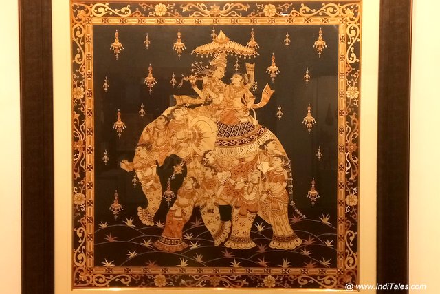 Radha Krishna riding on an intricately painted Elephant