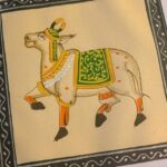 Decorative cow painting - a sacred, recurring motif symbolizing abundance, protection, and divinity